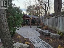 Fenced backyard featuring a patio area - 