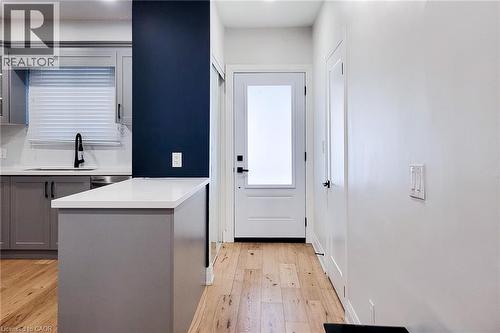 Doorway to outside with hardwood / wood-style floors and a sink - 51 West Avenue N, Hamilton, ON - Indoor