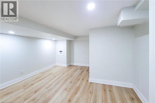 Finished below grade area with light wood-style floors and recessed lighting - 51 West Avenue N, Hamilton, ON - Indoor Photo Showing Other Room