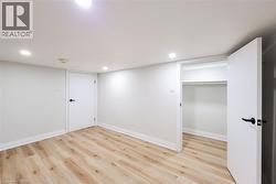 Finished basement featuring light wood-style floors and recessed lighting - 