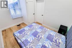 Bedroom with wood finished floors - 