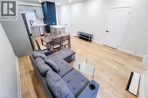 Living area featuring light wood-style flooring and recessed lighting - 51 West Avenue N, Hamilton, ON - Indoor Photo Showing Other Room