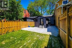 Fenced backyard featuring a patio area and entry steps - 