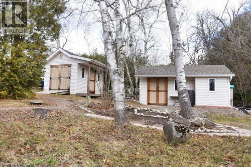 View of front of property with a shingled roof and a storage unit - 1085 10Th Concession Road W Unit# 77, Flamborough, ON - Outdoor
