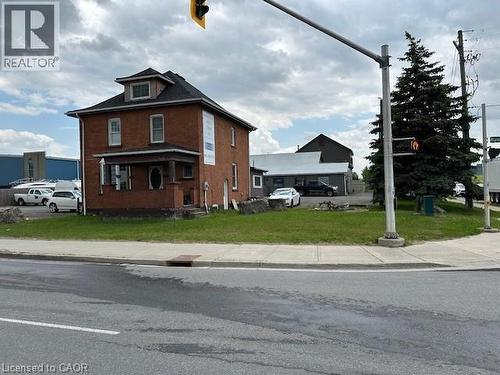 View of front facade with a front yard and brick siding - 1360 E Rymal Road E, Hamilton, ON 