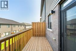 Wooden terrace featuring a residential view - 