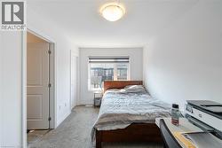 Bedroom featuring carpet and baseboards - 