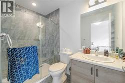 Full bath featuring vanity and a stall shower - 