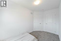 Bedroom with carpet and baseboards - 