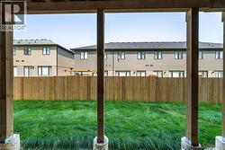 Fenced backyard featuring a residential view - 