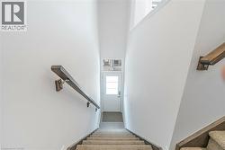 Stairway featuring a high ceiling - 