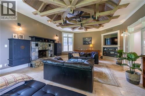used as informal living room - 265 Front Road, St. Williams, ON - Indoor Photo Showing Living Room With Fireplace