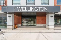 View of exterior entry featuring brick siding - 