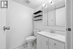 Bathroom featuring vanity and light tile patterned floors - 