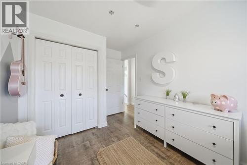 Bedroom featuring dark wood-style flooring and a closet - 136 Braemar Avenue, Caledonia, ON - Indoor Photo Showing Bedroom