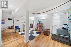 Recreation room featuring light wood finished floors and recessed lighting - 