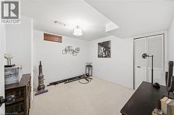 Exercise room with carpet floors and baseboards - 