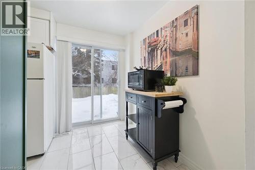 Doorway to outside with marble look tiles - 11 Ingleside Drive, Kitchener, ON - Indoor Photo Showing Other Room