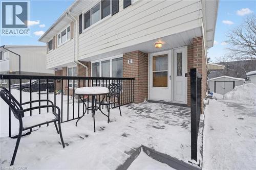 Snow covered patio with a storage shed - 11 Ingleside Drive, Kitchener, ON - Outdoor With Exterior