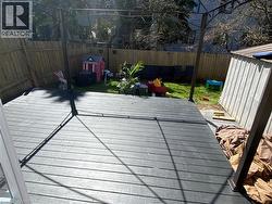 Deck with a fenced backyard - 