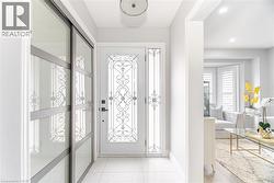 Entryway featuring recessed lighting and baseboards - 