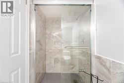 Full bath featuring a shower stall - 