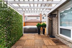 Wooden terrace featuring a pergola - 