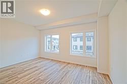 Empty room featuring light wood-style flooring - 