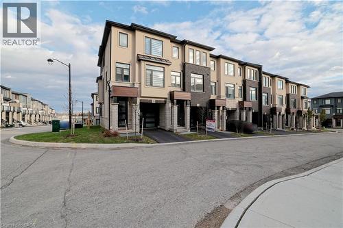 View of property featuring a residential view - 155 Equestrian Way Unit# 114, Cambridge, ON - Outdoor With Facade