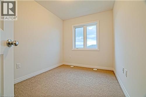 Spare room featuring carpet flooring - 155 Equestrian Way Unit# 114, Cambridge, ON - Indoor Photo Showing Other Room