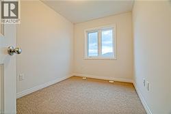 Spare room featuring carpet flooring - 