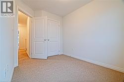 Unfurnished bedroom featuring carpet floors and a closet - 