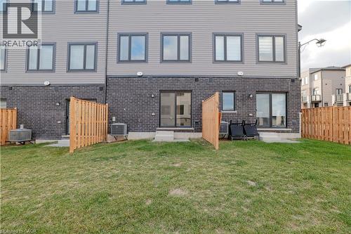 Back of house featuring brick siding - 155 Equestrian Way Unit# 114, Cambridge, ON - Outdoor