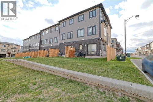 View of building exterior with a residential view - 155 Equestrian Way Unit# 114, Cambridge, ON - Outdoor