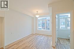 Unfurnished dining area featuring light wood-type flooring - 