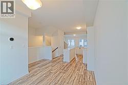 Empty room with light wood-style floors and baseboards - 