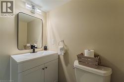 Half bath with vanity and toilet - 