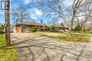 View of front of property with brick siding, aphalt driveway, a front lawn, and a chimney - 9 Gavin Drive, St. Catharines, ON  - Outdoor 