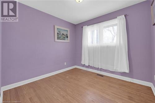 Unfurnished room with wood finished floors, baseboards, and visible vents - 9 Gavin Drive, St. Catharines, ON - Indoor Photo Showing Other Room