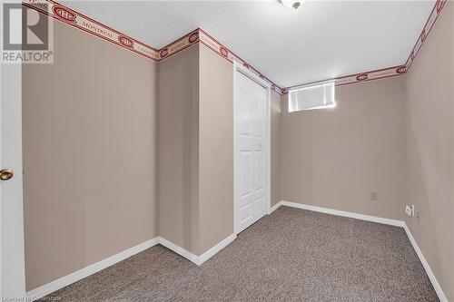 Carpeted spare room with baseboards and a textured ceiling - 9 Gavin Drive, St. Catharines, ON - Indoor Photo Showing Other Room