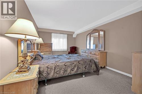 Carpeted bedroom featuring baseboards - 416 Limeridge Road E Unit# 309, Hamilton, ON - Indoor Photo Showing Bedroom