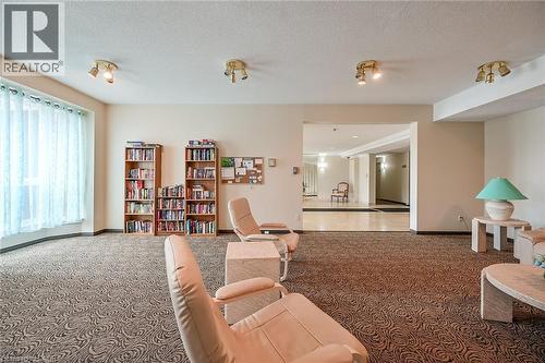 Carpeted living room with baseboards - 416 Limeridge Road E Unit# 309, Hamilton, ON - Indoor Photo Showing Other Room