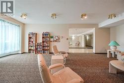 Carpeted living room with baseboards - 