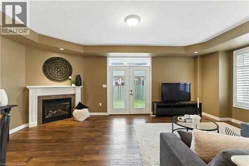 100 Fall Fair Way, Binbrook, ON - Indoor Photo Showing Living Room With Fireplace