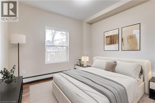 Staged Bed Upper unit - 152 Sanford Avenue S, Hamilton, ON - Indoor Photo Showing Bedroom