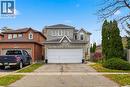 Traditional home featuring asphalt driveway, a garage, and a shingled roof - 3372 Bobwhite Mews, Mississauga, ON 