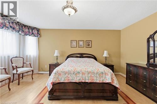 Bedroom with light wood-type flooring and baseboards - 3372 Bobwhite Mews, Mississauga, ON 