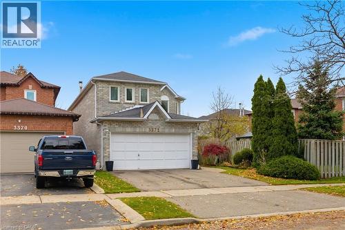 Traditional home featuring a garage and driveway - 3372 Bobwhite Mews, Mississauga, ON 