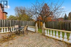 Fenced backyard featuring outdoor dining space and a patio area - 