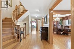 View of front of house featuring brick siding, asphalt driveway, and an attached garage - 